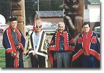 A photo of Gitanyow Chiefs and Totem Poles